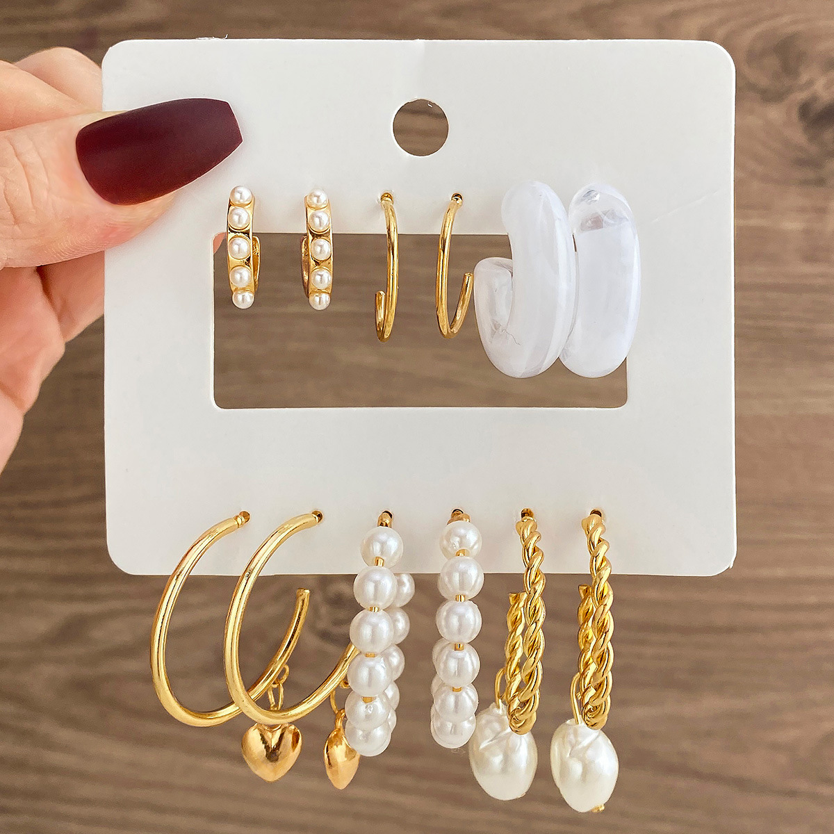 Cross-border exquisite stud earrings, resin ear rings, fashionable OL design sense, metal ear rings, heart-shaped pearl earrings and earrings wholesale full figure