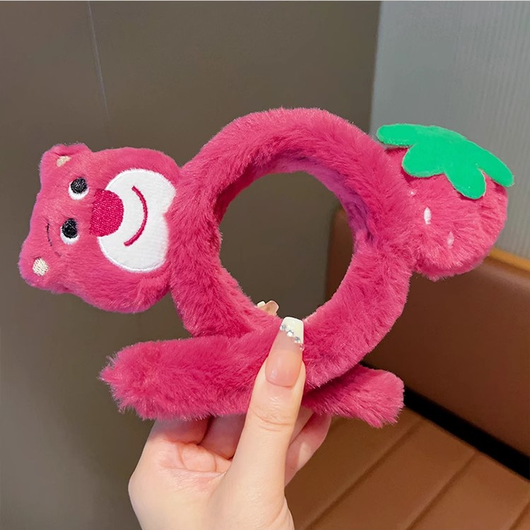A teenage girl washes her face and presses her hair with a strawberry bear hairband. A popular girl has a cute plush strawberry headband. She applies a facial mask with hair clips and headwear Application Scenario