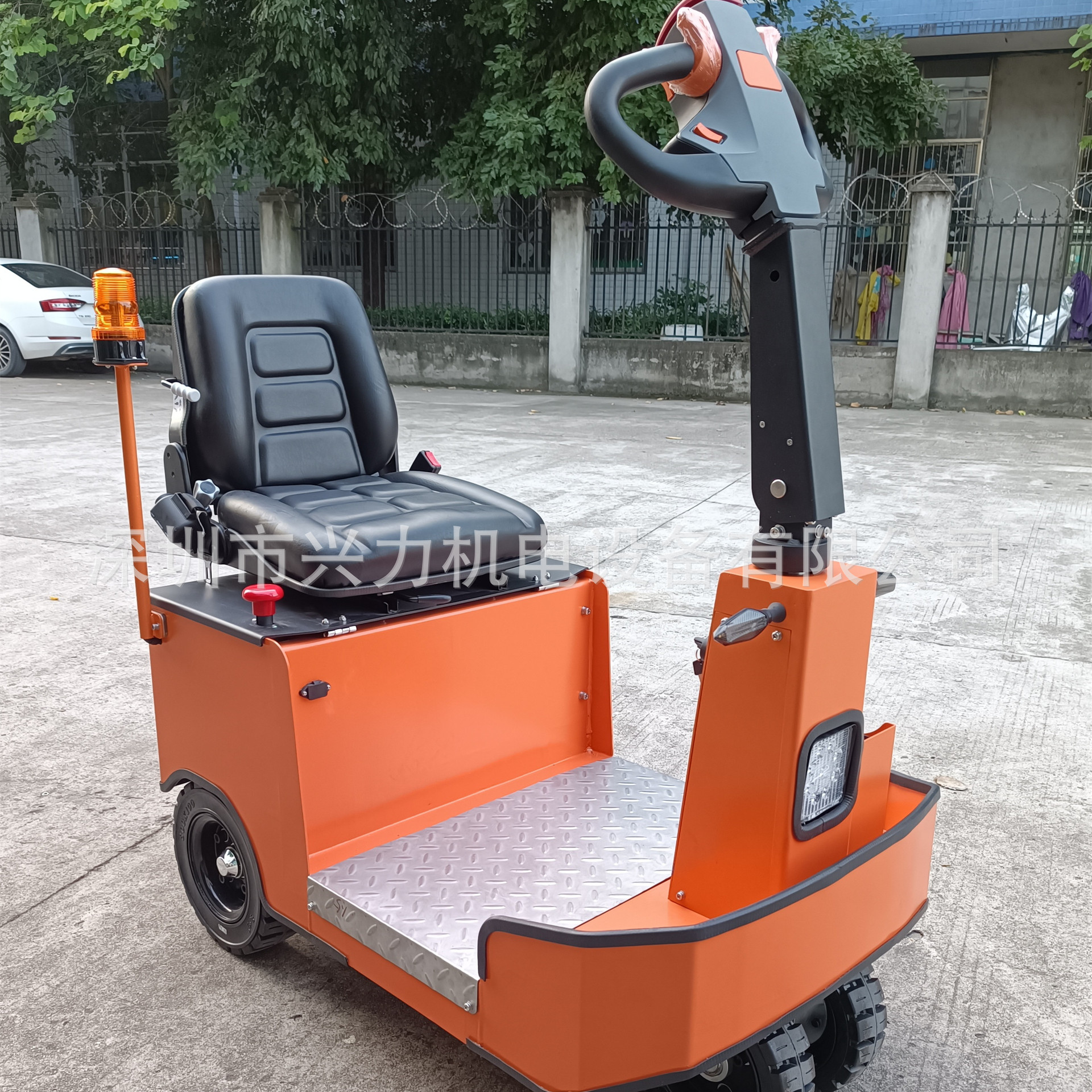 A ride-on tractor, an open electric tractor, or a stand-up towing trailer with a capacity of 1.5 to 3 tons is easy to pull full figure