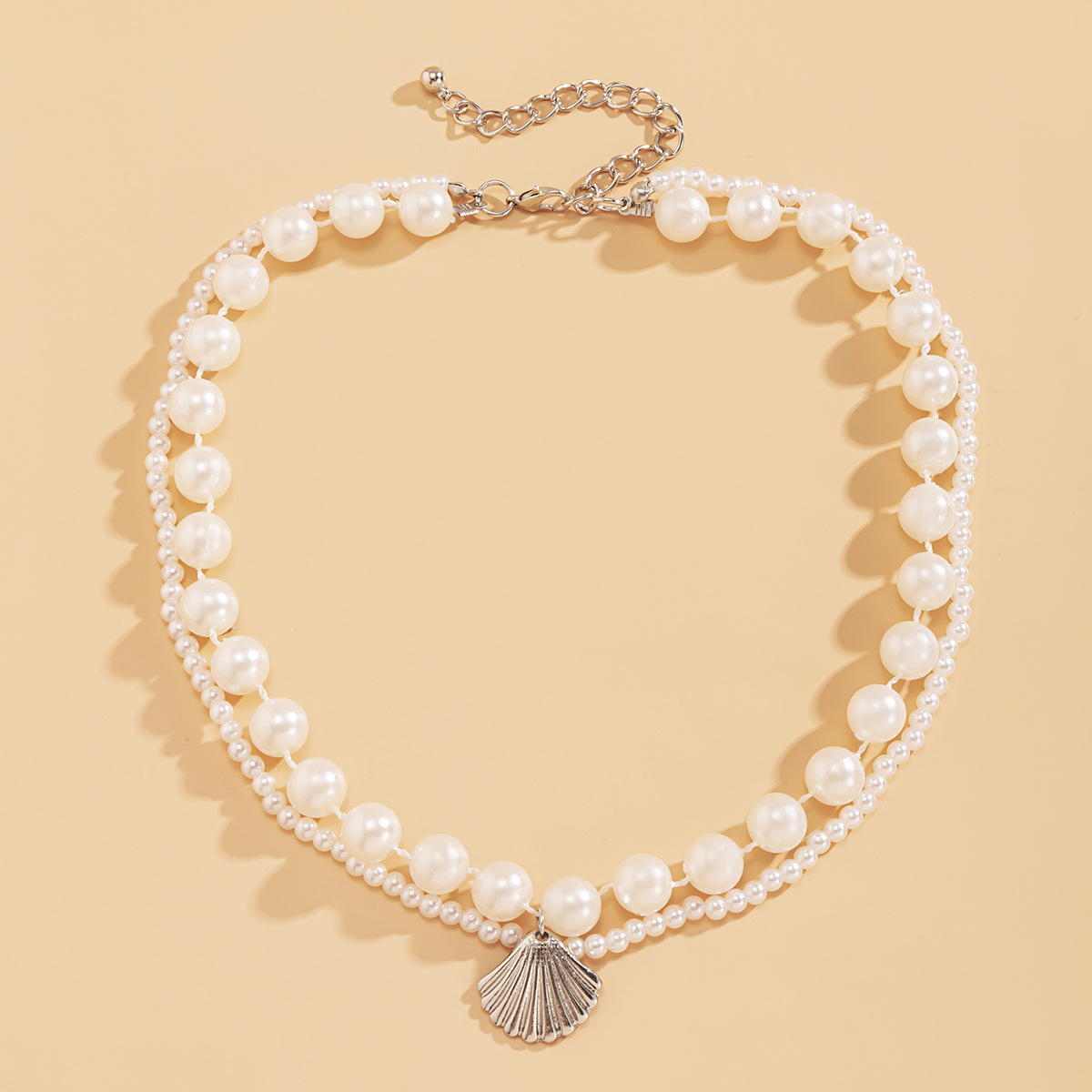 A double-layered imitation pearl necklace in the style of European and American countryside, with a female ethnic style, featuring stacked shell round bead chains and necklaces details Picture