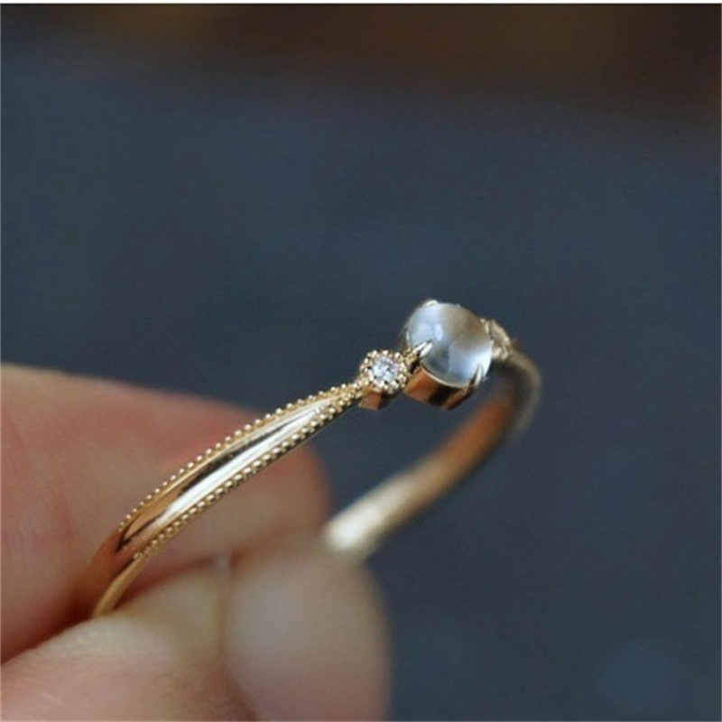Japanese-style white moonlight ring, women's moonlight stone egg surface open index finger ring, retro artistic light luxury high-end ring jewelry Application Scenario