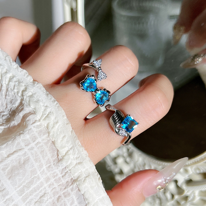 Fashionable and individual sea blue heart-shaped zircon bow open ring, a unique and niche geometric ring for women with a light luxury touch full figure