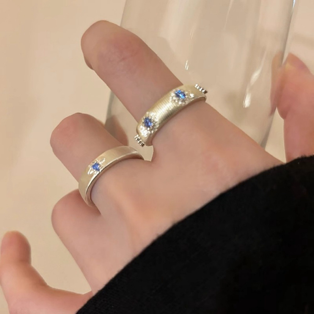 A sea blue zircon cross brushed ring, a niche design for women, is a couple's index finger ring with a light luxury and high-end feel full figure