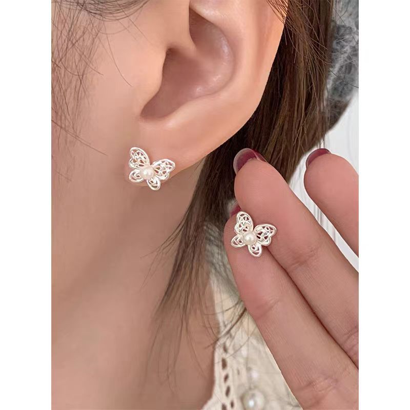 Korean-style hollowed-out butterfly pearl earrings on Instagram, a niche, sweet, exquisite and elegant style. New earrings for women with ear bone studs in 2025 full figure