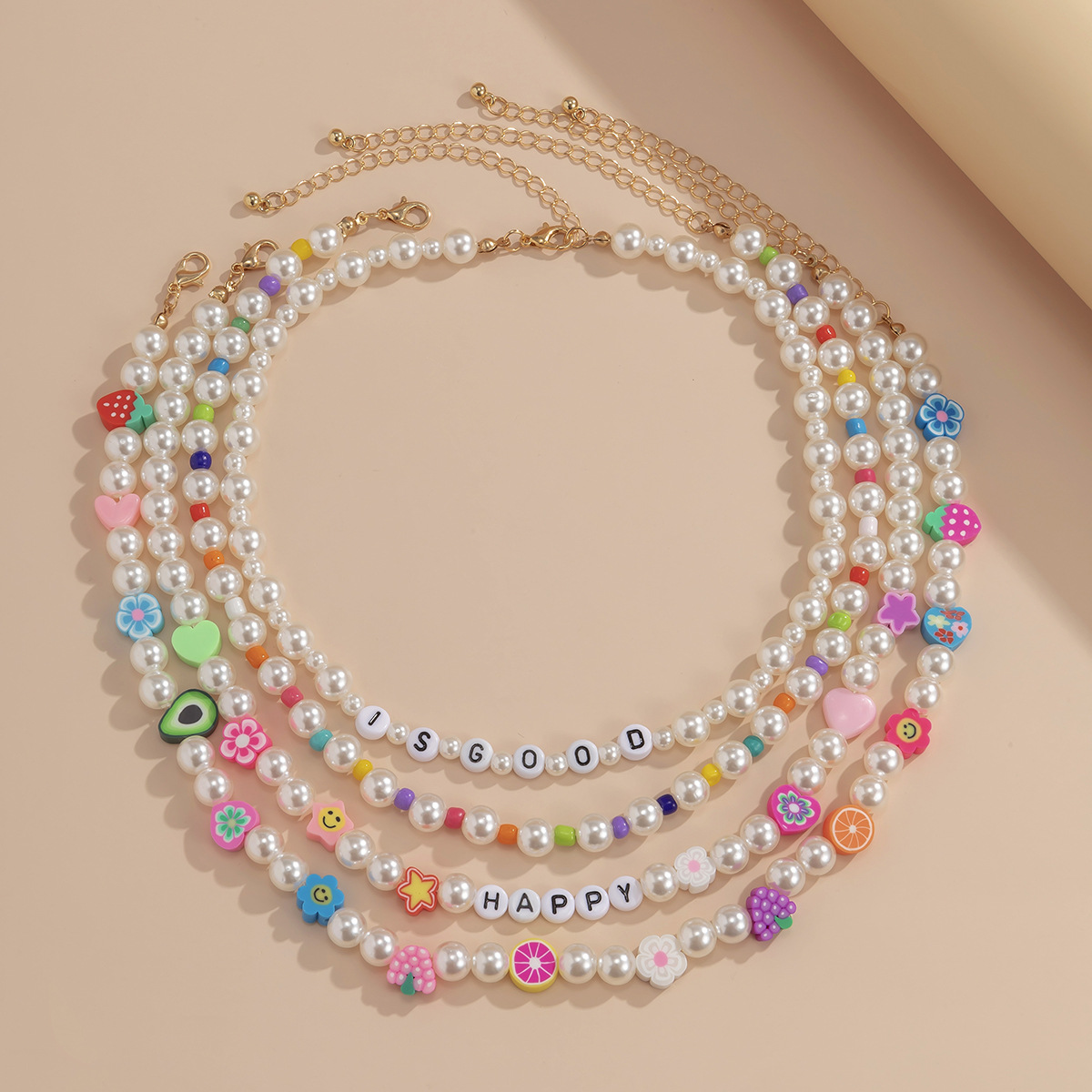 A pastoral and fresh, color-blocking fruit soft clay layered necklace, a retro European and American imitation pearl acrylic letter collarbone chain details Picture