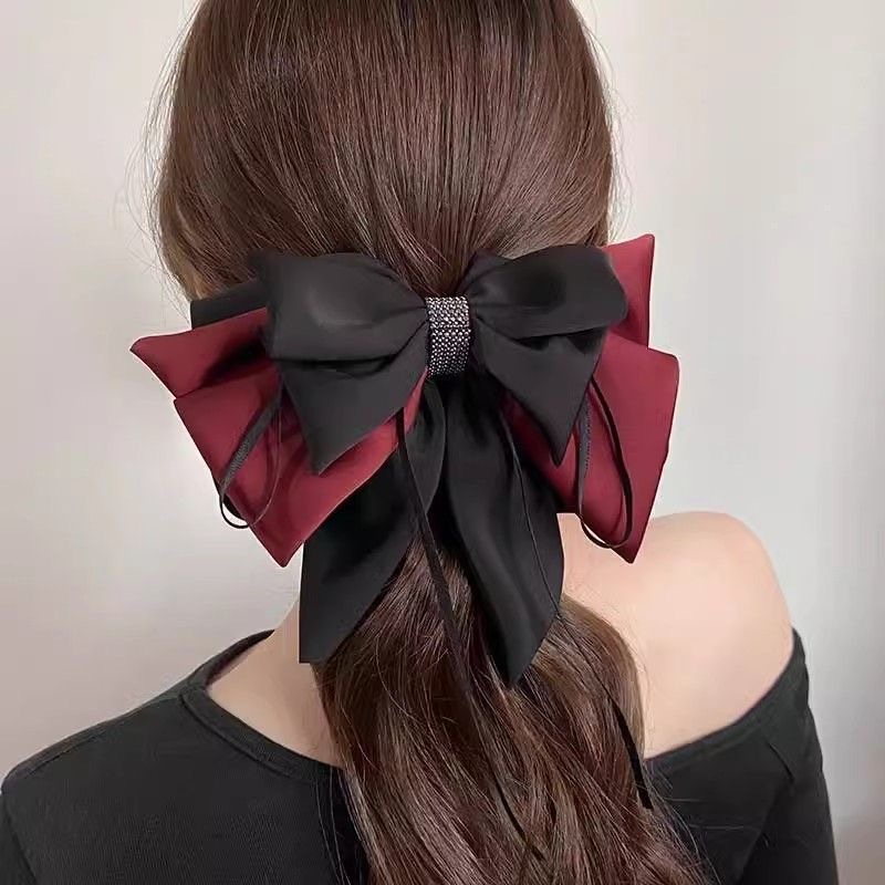 The new high-end color-blocking bow top clip is the same as the popular high ponytail grab clip and the elegant shark hair clip at the back of the head full figure