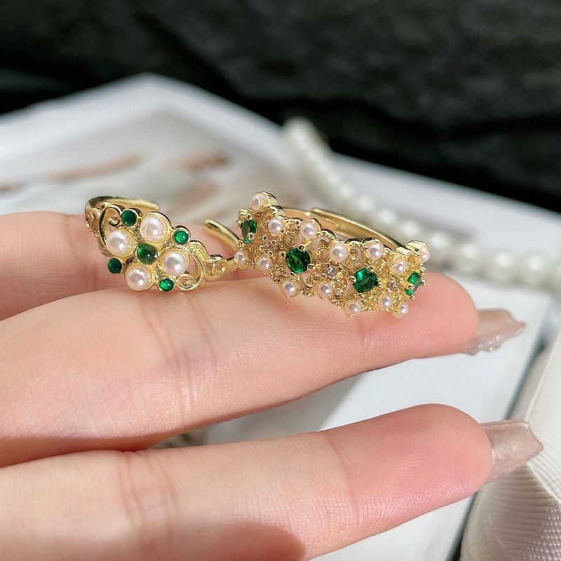 The ring features a feminine court-style lace, hollowed-out pearl inlay, adjustable ring, a niche design, and a retro, light luxury accessory trend full figure
