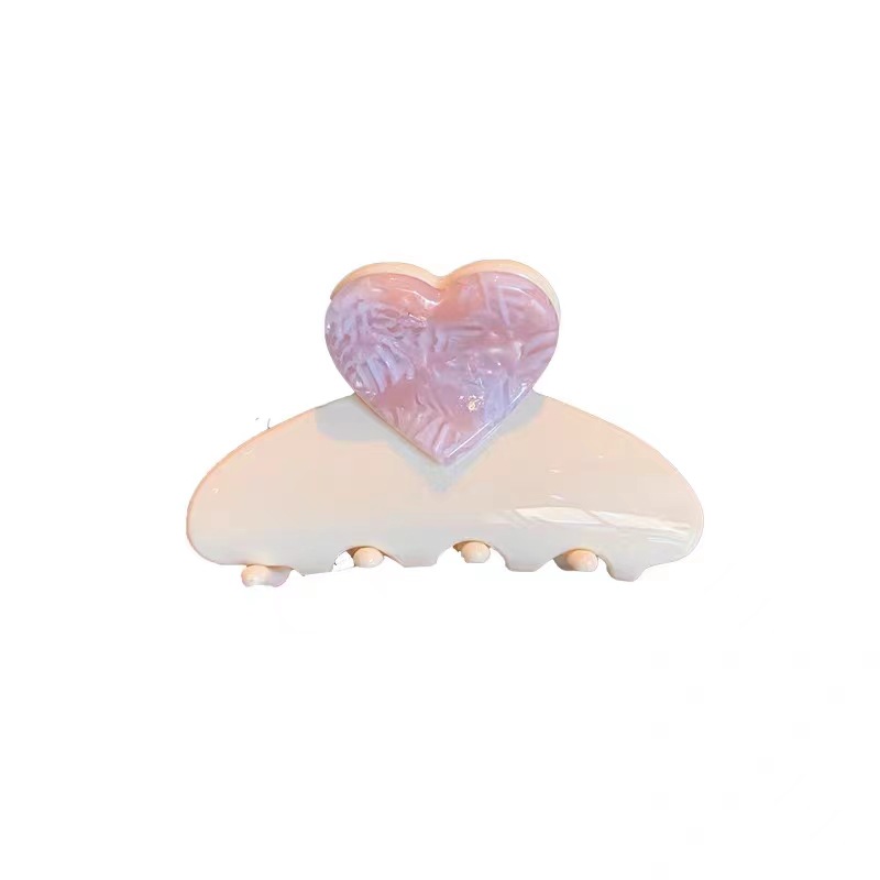 A sweet and heart-shaped acetate hairpin from a Korean girl, with a high ponytail clip and an elegant half-tied hairpin at the back of her head Item Picture