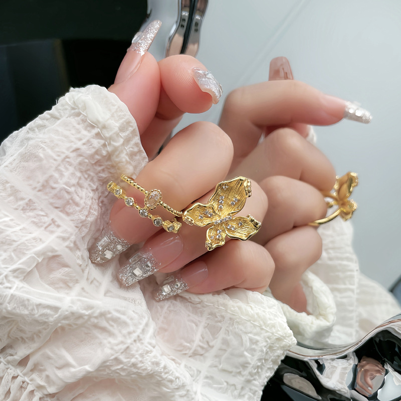 Ancient-style golden butterfly ring for women, set with zircon, with a niche design sense, light luxury and exquisite, double-layer sweet and cool index finger ring trend Application Scenario