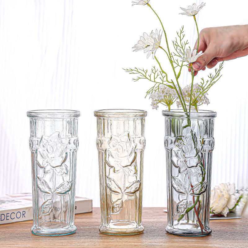 A light luxury Nordic minimalist glass vase with transparent water-grown flowers, lucky bamboo and lilies. A vase decoration for the living room and dining table full figure