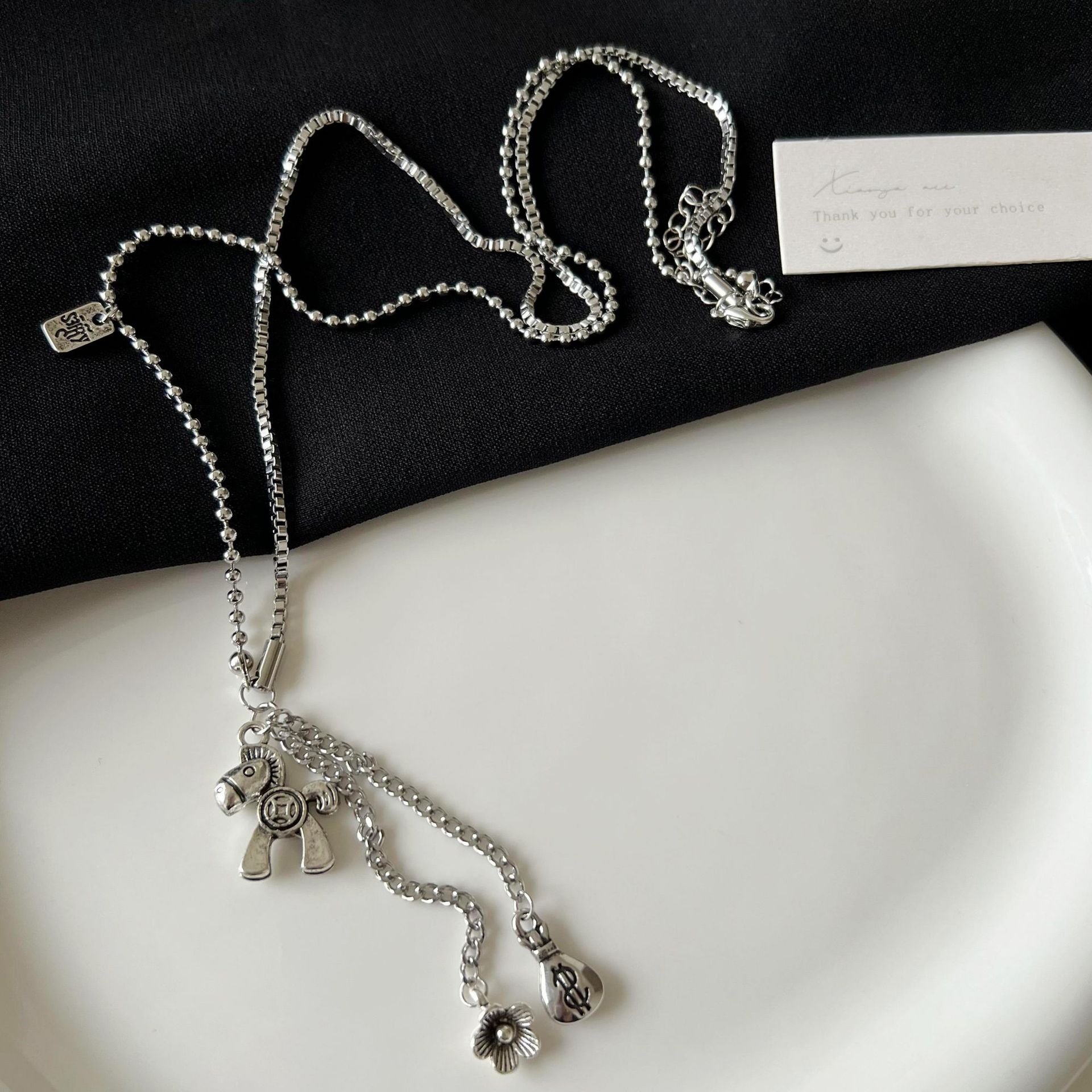 The upcoming Money Flower titanium steel necklace is a unique and stylish accessory for women's autumn and winter collection that pairs well with sweatshirts on Instagram details Picture