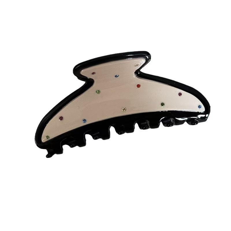 A new polka dot hair clip headwear featuring a sweet and cute Korean color diamond scratch-clip on the back of a woman's head and a stylish shark clip Item Picture