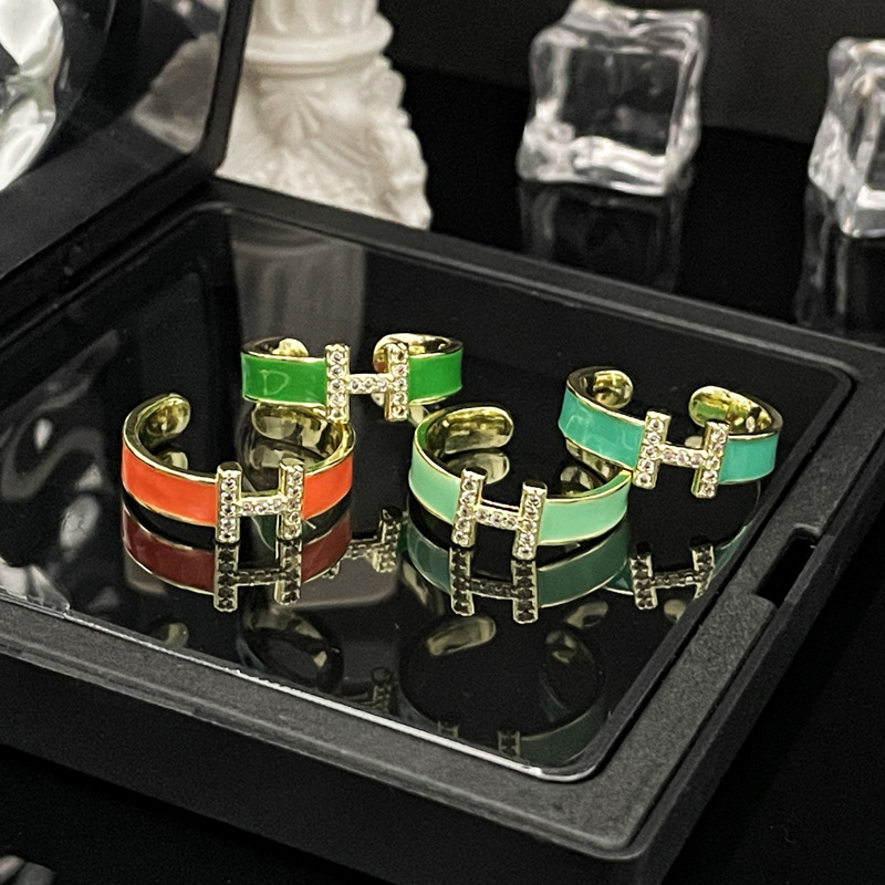 A Mambo style mint green enamel drop glaze H-letter open ring for women, a retro, light luxury, and court-style fashionable ring Application Scenario