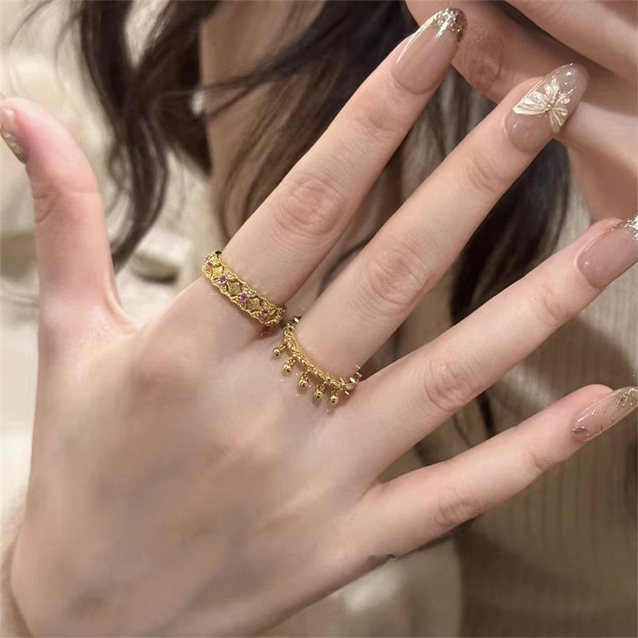 A new mid-style hollowed-out lace rattle tassel ring for women with a light luxury and niche design, exuding a sense of high-end elegance Item Picture