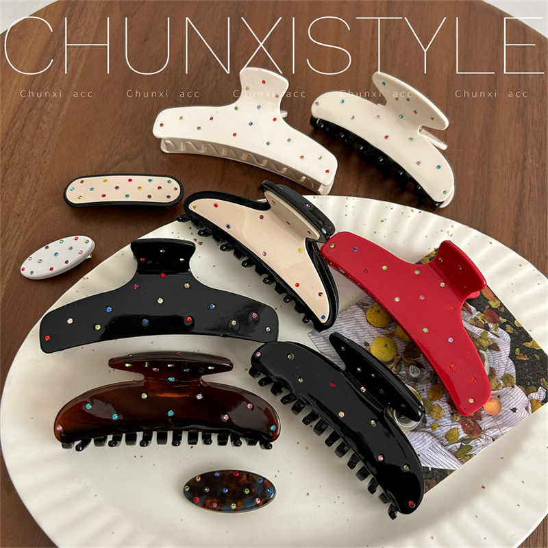 A new polka dot hair clip headwear featuring a sweet and cute Korean color diamond scratch-clip on the back of a woman's head and a stylish shark clip details Picture
