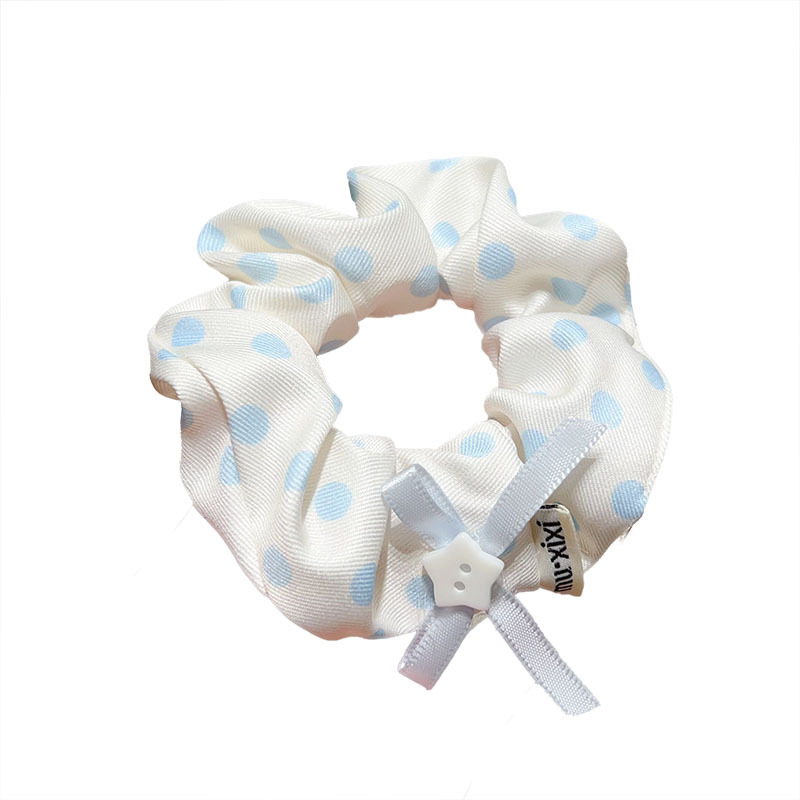 The Korean-style blue polka dot large intestine hair band exudes a high-end and laid-back vibe for women. It features a low ponytail hair accessory and a simple hair tie Item Picture