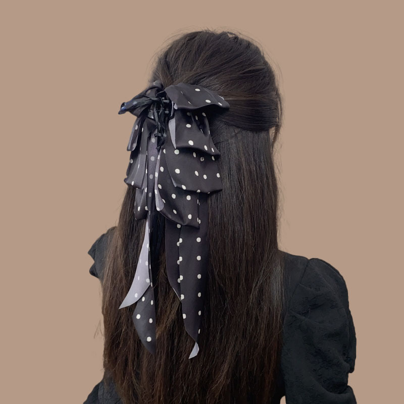 The new women's hair accessory with a large ribbon polka dot bow and a high ponytail clip makes the face look smaller. The hair clip at the back of the head is black details Picture