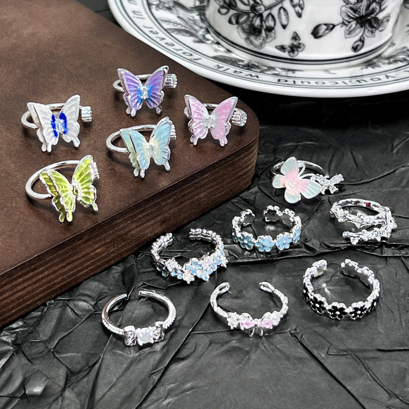 A new French summer ring with a fresh and light design sense, featuring a luxurious silver flower butterfly gradient enamel ring for women details Picture