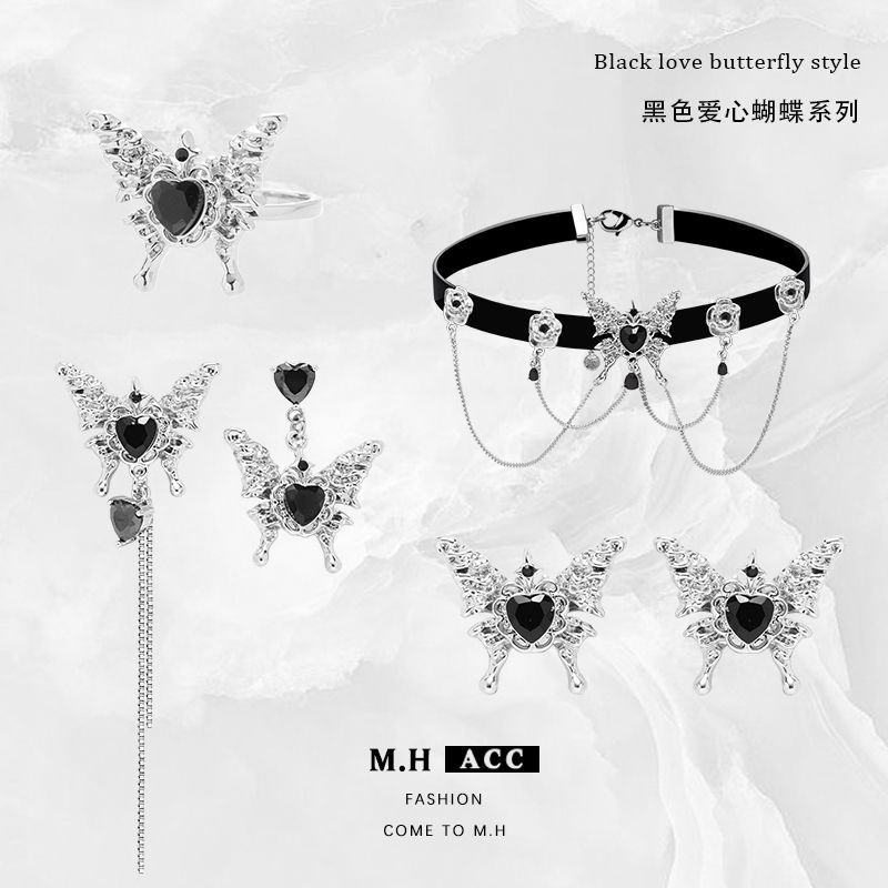 Black heart-shaped butterfly earrings with a niche design sense, a high-end winter look. 925 silver needle stud earrings, fashionable and individual full figure