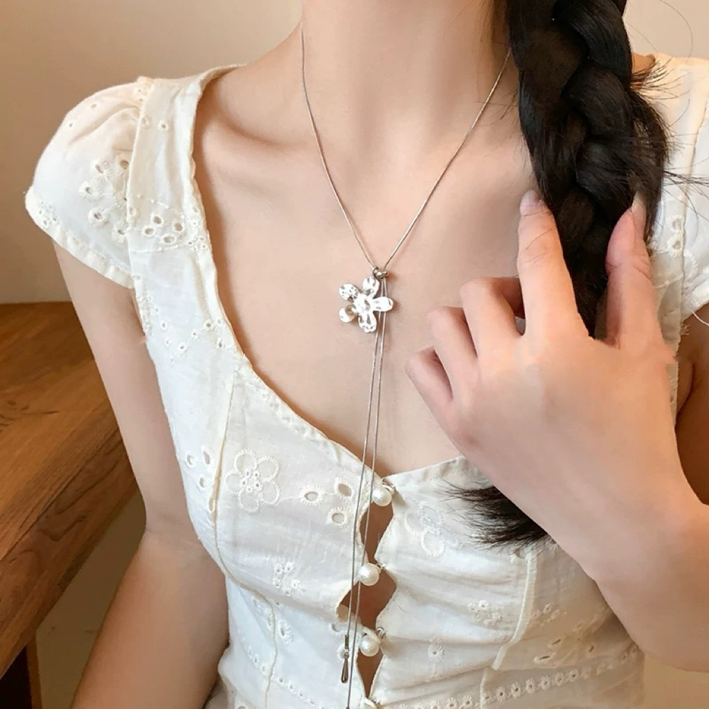 Korean fashion layered silver pleated flower long necklace with a unique design sense for women, pearl collarbone chain sweater chain details Picture