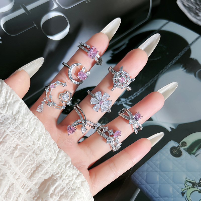 The new autumn and winter collection features a sweet pink diamond flower light luxury open ring for a female rabbit with an irregular shape, exquisite and versatile layering ring full figure