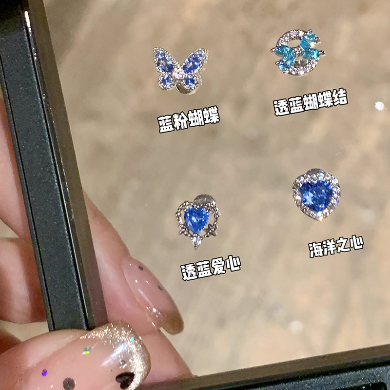 Exquisite blue heart-shaped zircon ear studs for women's sweet and cool style, versatile and high-end ear bone studs, unique best-selling earrings wholesale full figure