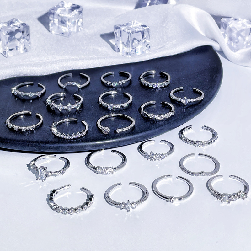 The ring is a niche design for women, with a simple and individual style. It features a fine circle of zircon with an open ring, exuding a cold and elegant vibe. It is a trendy index finger ring with a layered design Application Scenario