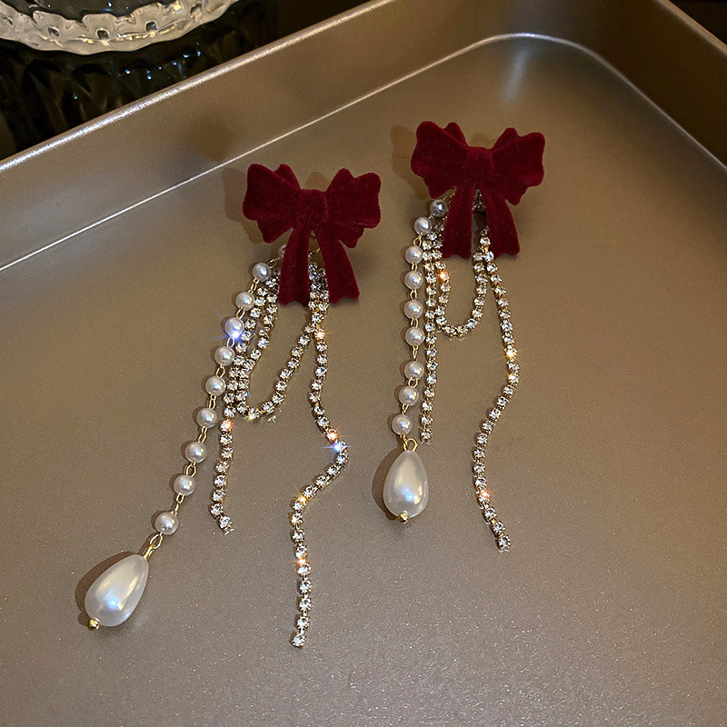 Long tassel flocked bow stud earrings for women, light luxury, fashionable, versatile, high-end and elegant ladylike earrings, a new trend Application Scenario