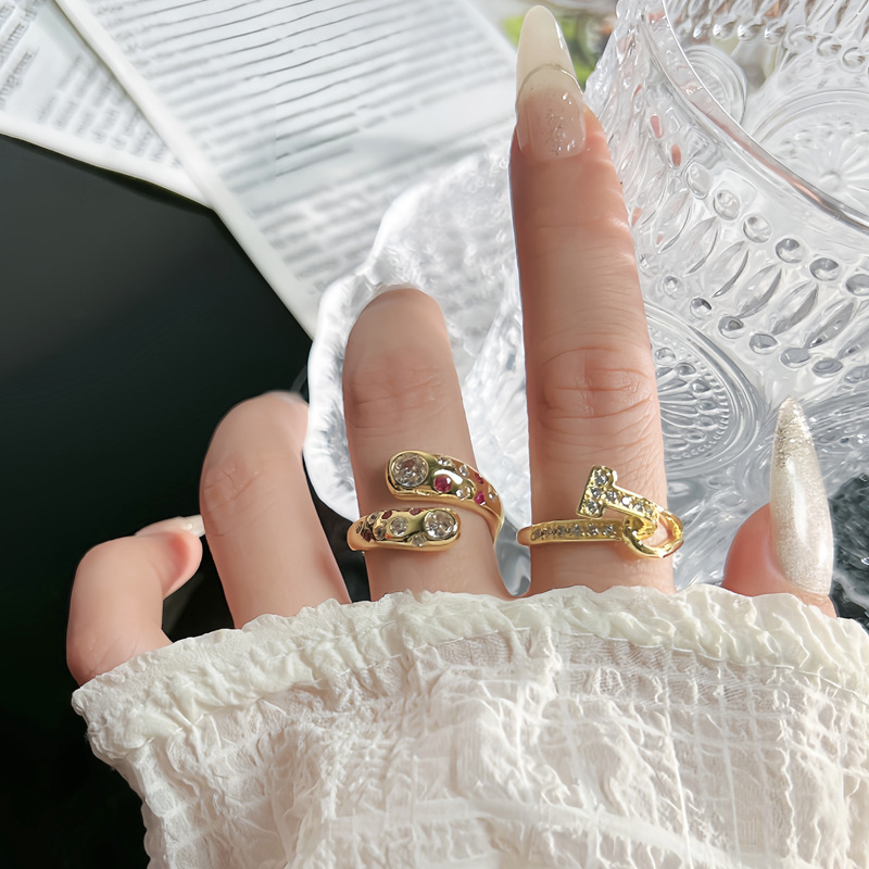A retro, light luxury diamond-encrusted ring for women, with a simple, niche and unique design sense. The T-shaped cross design exudes a unique and individualistic style. The ring is layered and worn full figure