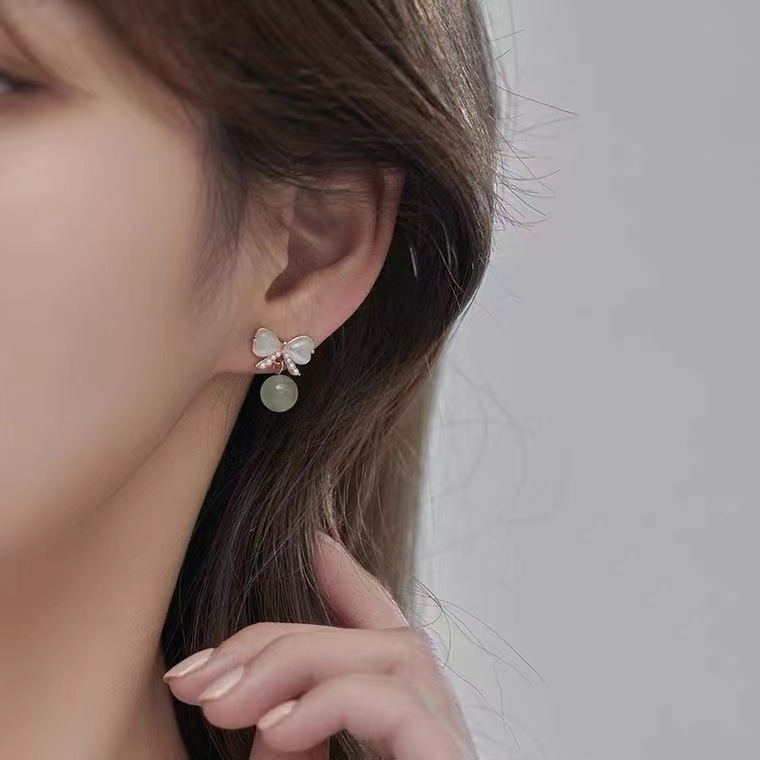 Light luxury and gentle temperament, cat's eye stone bow stud earrings for women, a new style of trendy ancient design earrings in 2025 details Picture