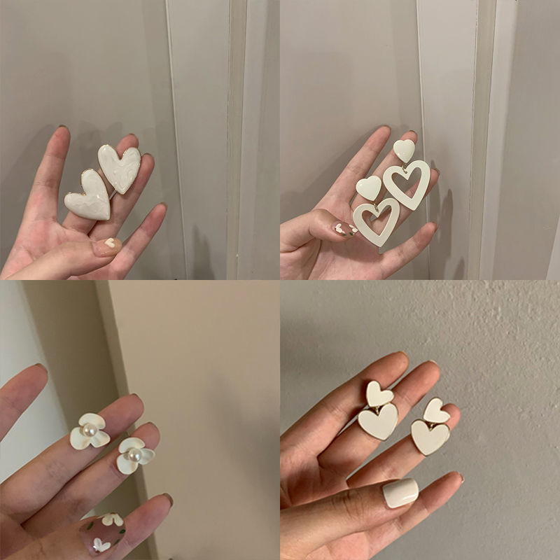 Autumn and winter heart-shaped milky white large earrings and stud earrings, cold style sweet earrings, round face women's earrings, 2025 new style full figure