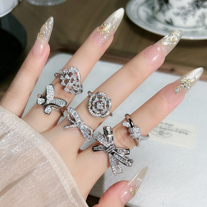 A French-style, light luxury and high-end ring with a full diamond bow and geometric lines, featuring an open opening, is a niche and fashionable ring with a cold and feminine style details Picture