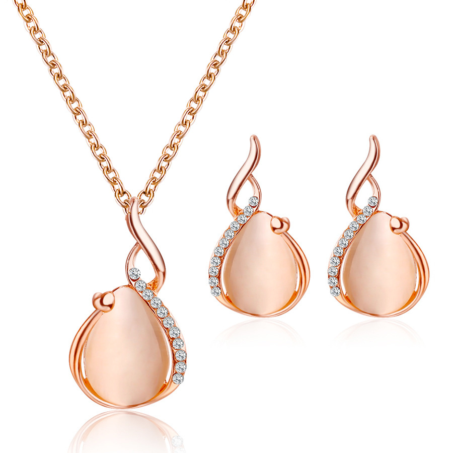 A new European and American bridal jewelry set, featuring a simple crystal cat's eye stone teardrop-shaped necklace and earrings, as a two-piece accessory full figure