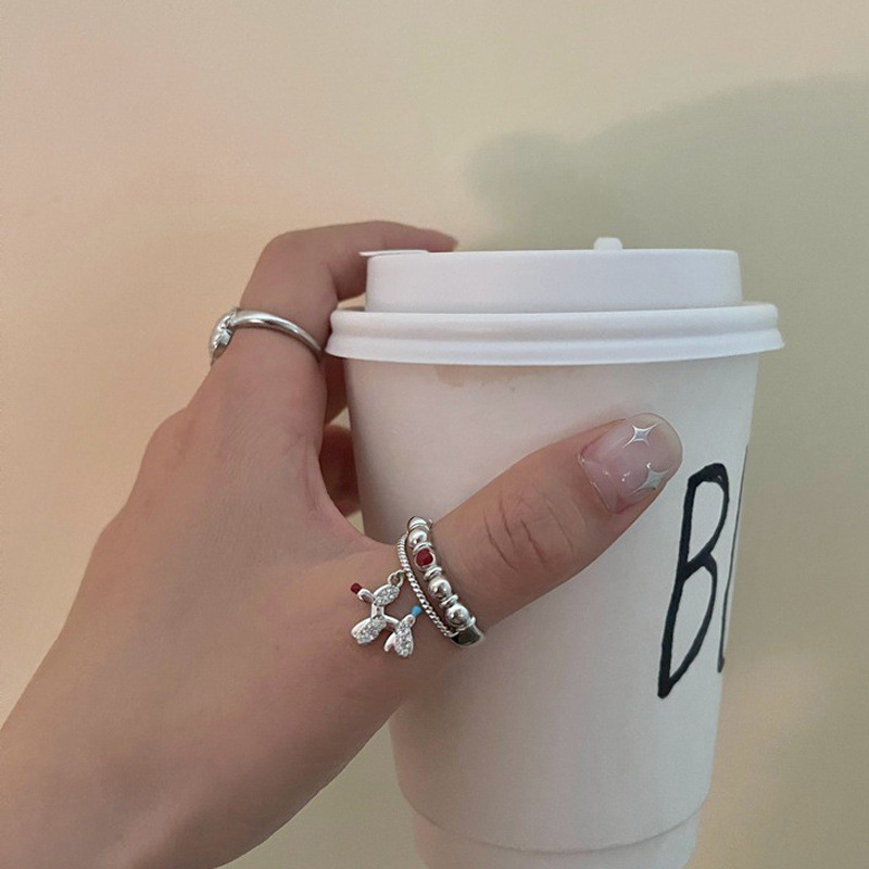 A niche cloud balloon dog open-mouth ring with a feminine personality and a high-end feel, featuring an INS style and a light luxury design. It's a cute food ring details Picture