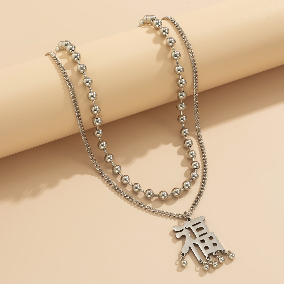 Creative "Fu" character tassel long alloy necklace for women, European and American cross-border jewelry, retro hollowed-out fine chain necklace Application Scenario