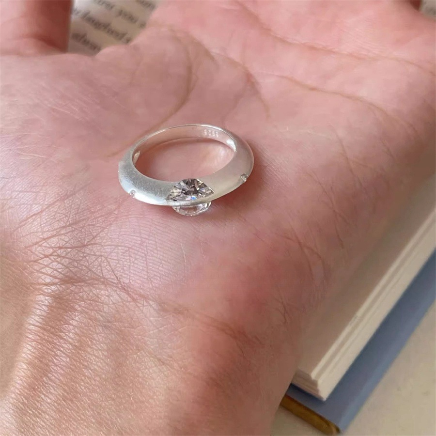 A rare and unique female design of a rotating zircon planet ring with a sparkling diamond opening Specification drawing