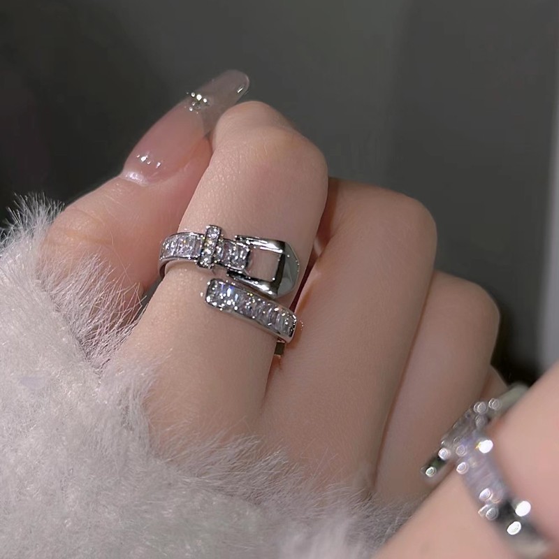 A trendy and cool woman's daily diamond-encrusted belt buckle ring, with a light luxury and niche design, is versatile and fashionable. The opening can be adjusted as an index finger ring Application Scenario