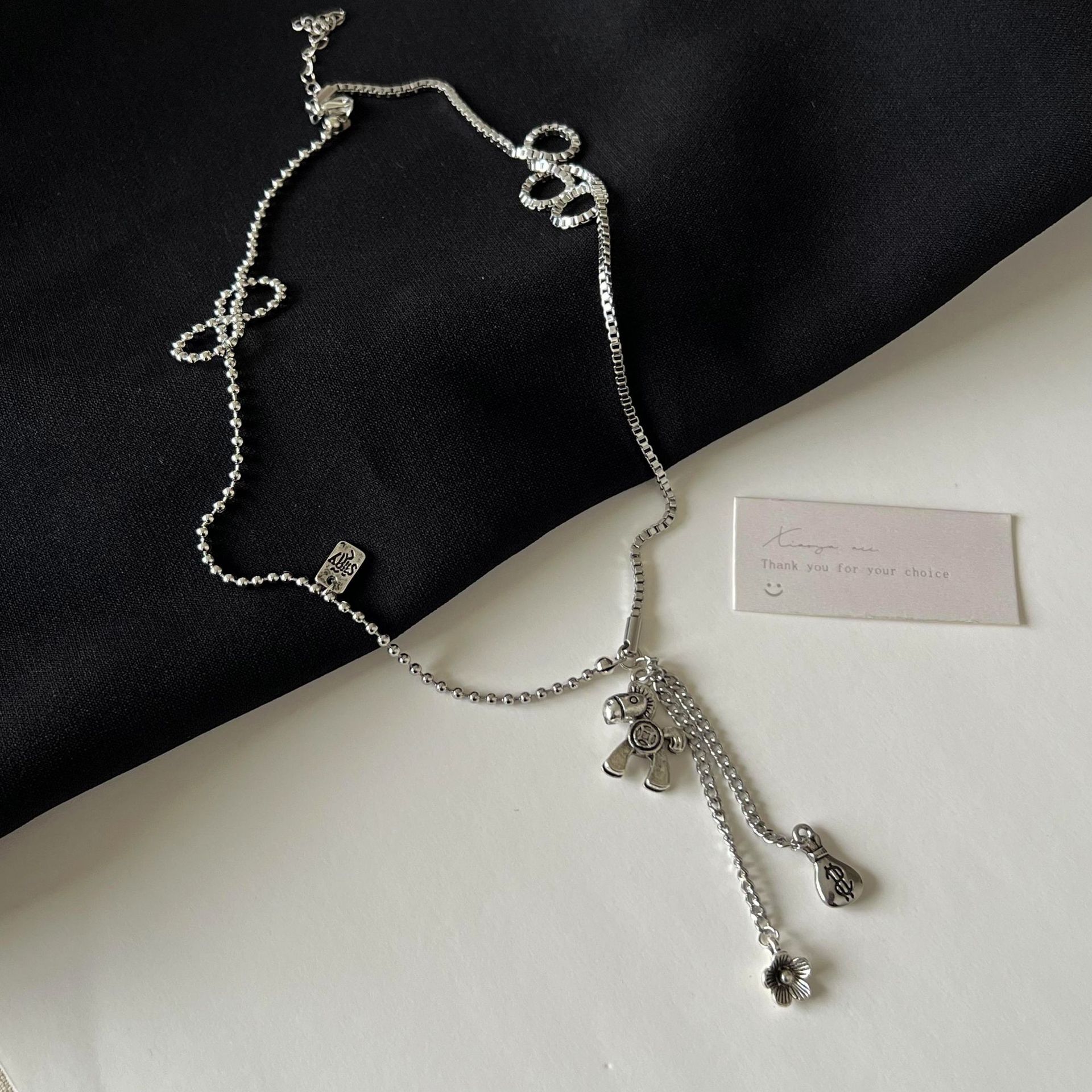 The upcoming Money Flower titanium steel necklace is a unique and stylish accessory for women's autumn and winter collection that pairs well with sweatshirts on Instagram Application Scenario