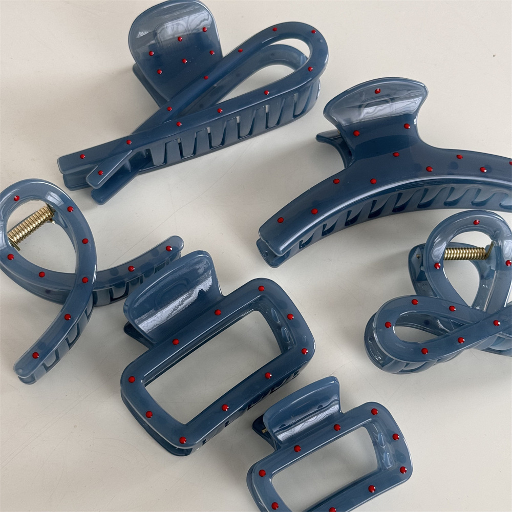 Han Yuan fog blue red polka dot grab clip, French high-end style, niche design, back of the head updo shark clip hair accessory Application Scenario
