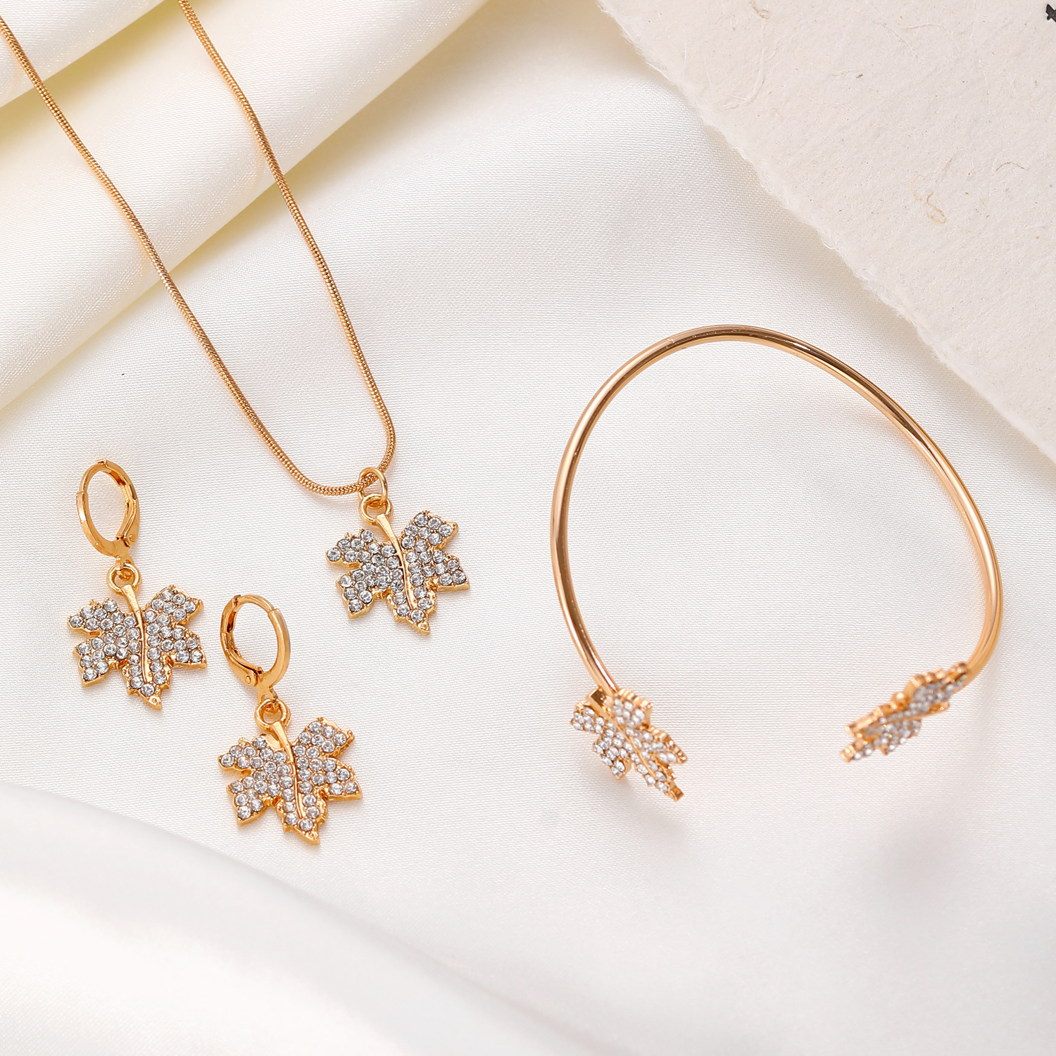 European and American ins style maple leaf necklace, earrings and bracelet set, high-end and light luxury autumn and winter diamond-encrusted jewelry three-piece set for women details Picture