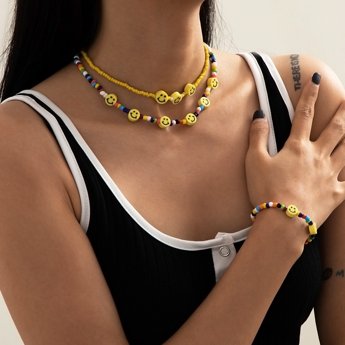 Simple and colorful rice bead chain necklace from Europe and America, elegant and stylish yellow smiling face jewelry set full figure