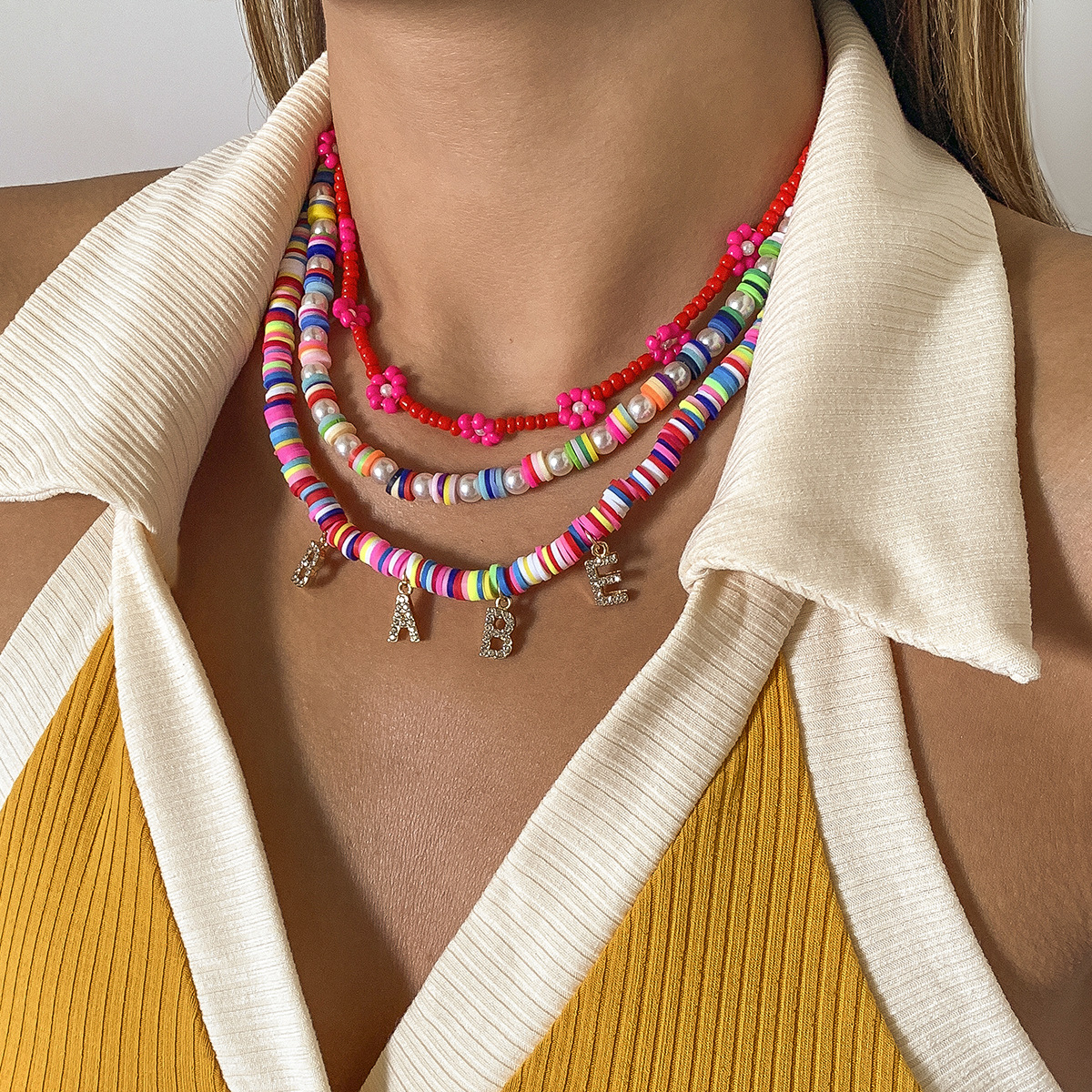 Retro ethnic style soft clay rice bead flower necklace, European and American cross-border jewelry, fashionable diamond-encrusted letter pearl necklace full figure