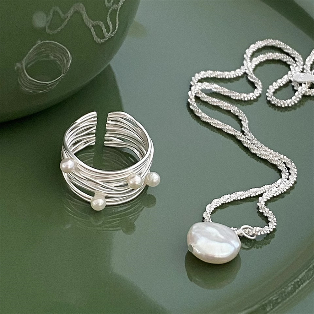 A high-end multi-layer line wound pearl open ring for women, S925 sterling silver, with a light luxury and fashionable niche design Application Scenario