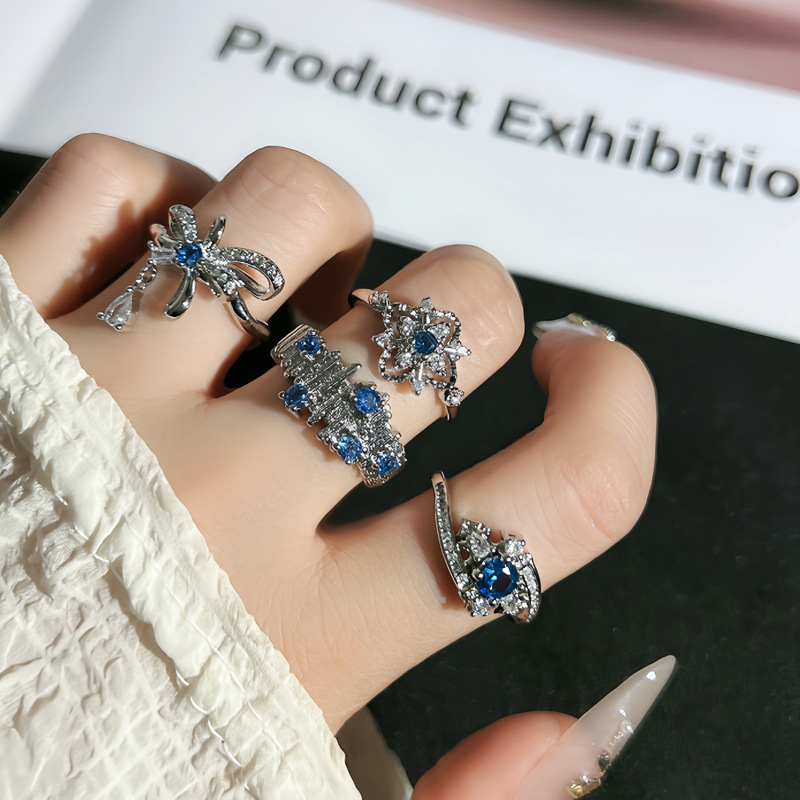 A mid-style sea blue zircon irregular pleated ring with a touch of luxury and sophistication for women, featuring a starry sky bow tassel ring details Picture