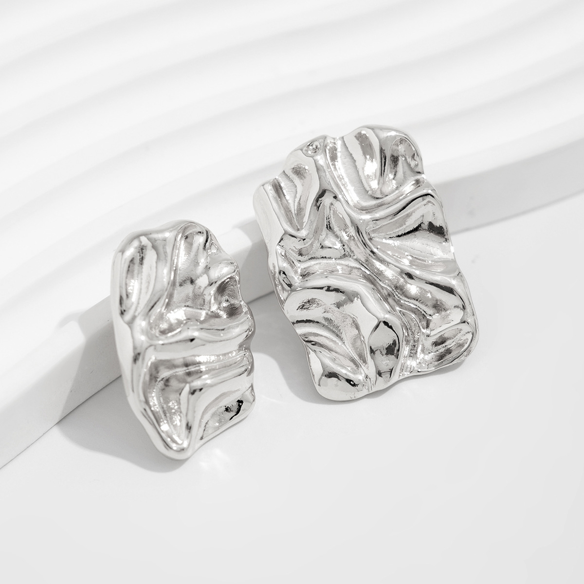 European and American cross-border jewelry: Exaggerated metallic concave-convex liquid earrings personalized pleated irregular large stud earrings Application Scenario
