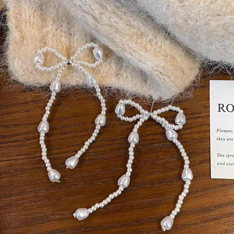 Pearl bow stud earrings, a new bestseller in 2025, are long tassel earrings with a light luxury, niche and high-end design Application Scenario