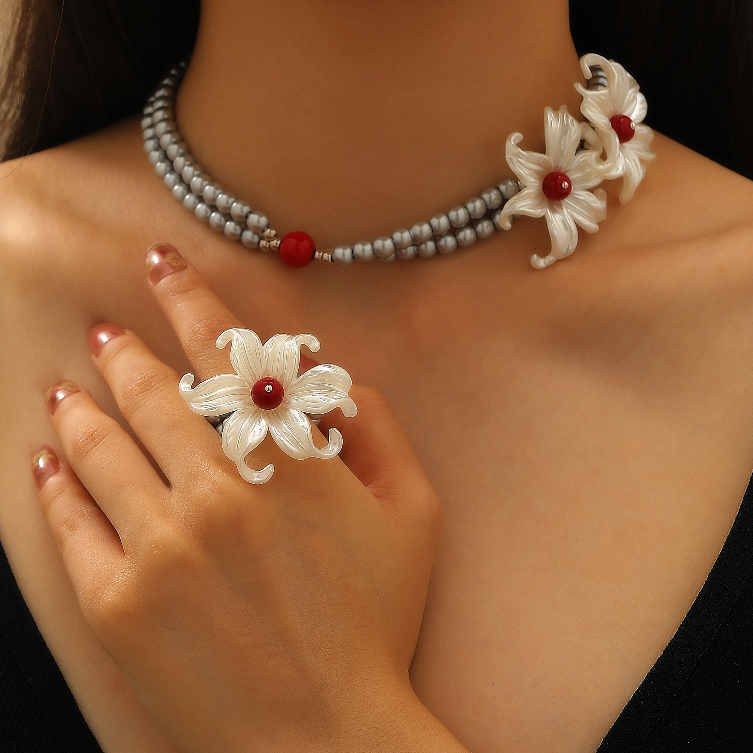 A unique design of iris flower silver pearl necklace with floral embellishments on the neck, a men's same style and a women's choker collarbone chain ring full figure
