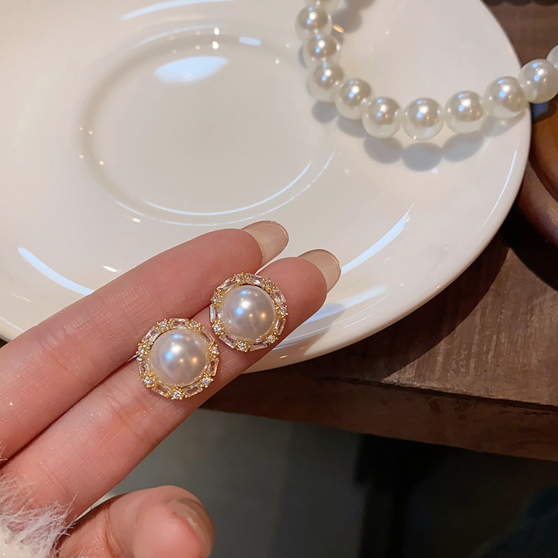 Light luxury and simple pearl earrings with round zircon stud earrings are versatile for women, exuding a sense of elegance and sophistication. They are trendy and popular earrings full figure