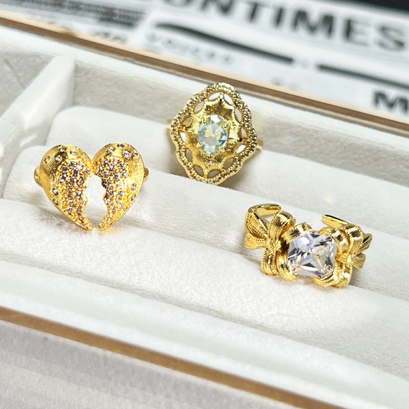 A Chinese-style pigeon egg, sea blue zircon open ring, a female heart bow, a fashionable brushed sweet and cool luxurious ring details Picture