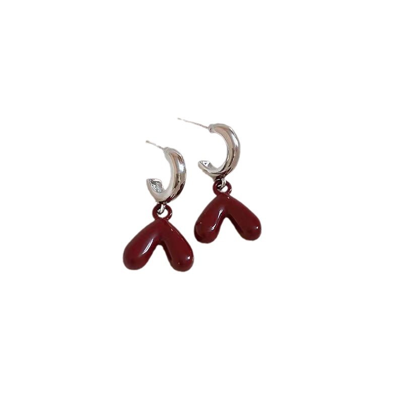 The Ankela red glazed heart-shaped pendant earrings are fashionable, sweet and elegant. The stud earrings exude a light luxury and high-end feel. They are versatile for women Item Picture